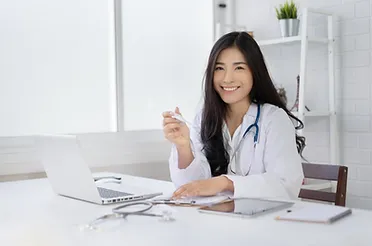 a woman in a white coat